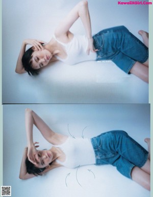 A woman in a white tank top and blue jeans posing for a magazine.