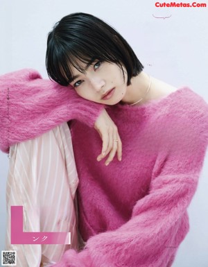 A magazine cover with a woman in a fur coat.
