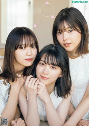 A group of young women standing next to each other.