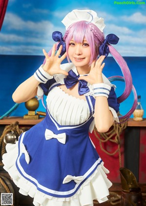 A woman in a blue bikini with a cat ears on her head.